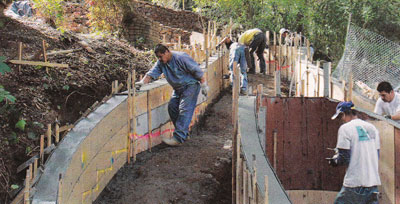 Tom Ralston Crew works with Wall forms on a Hillside decorative concrete project